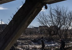 Труповете на най малко 20 души с цивилни дрехи лежаха днес